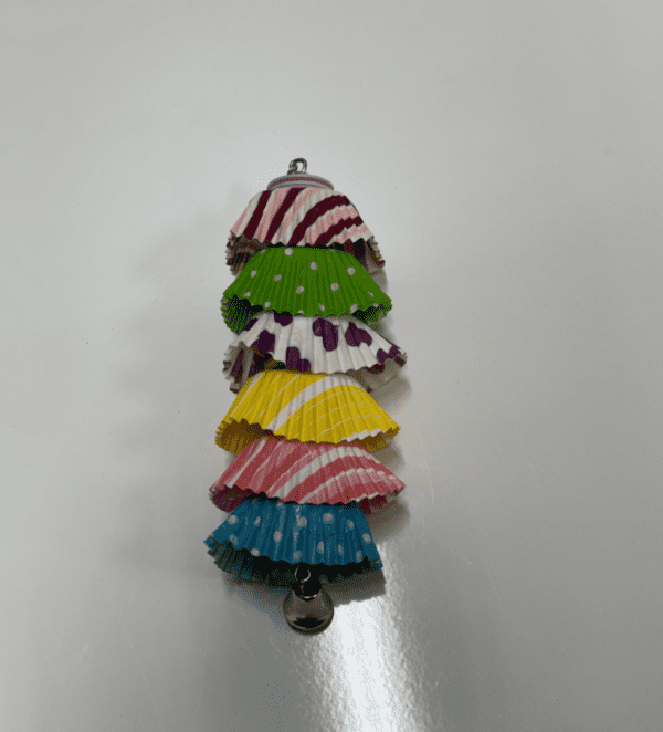A stack of colorful Cupcake Thiefs on a white surface.